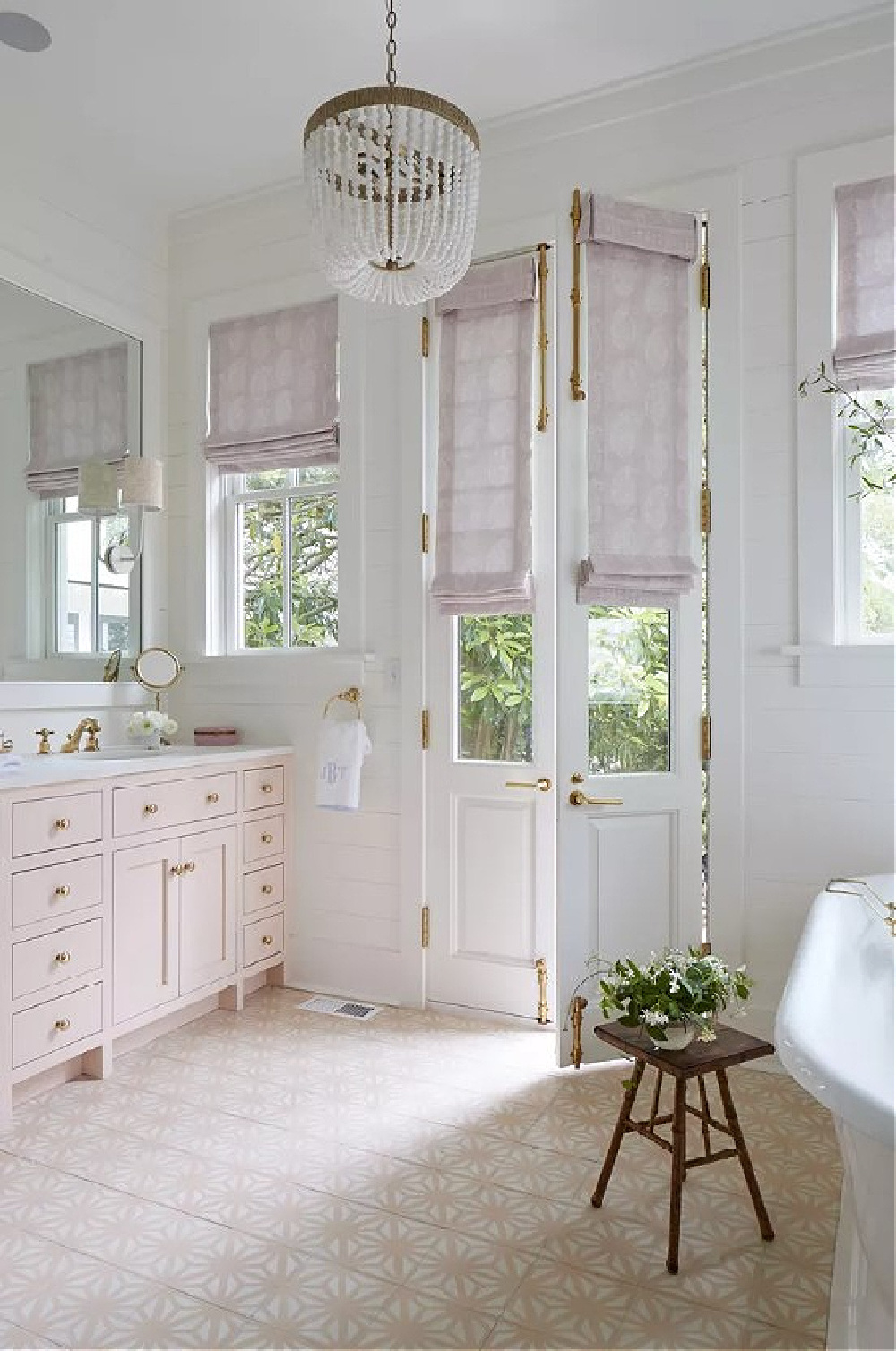Pink Ground on bath vanity in a Charleston home (Southern Living). #pinkground #charlestonhomes #pinkpaintcolors